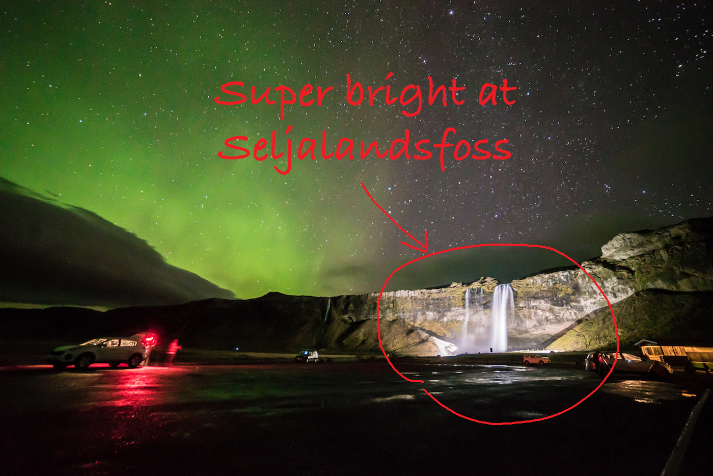 Seljalandsfoss brightly lit with flood lights. Easy for cameras to focus
